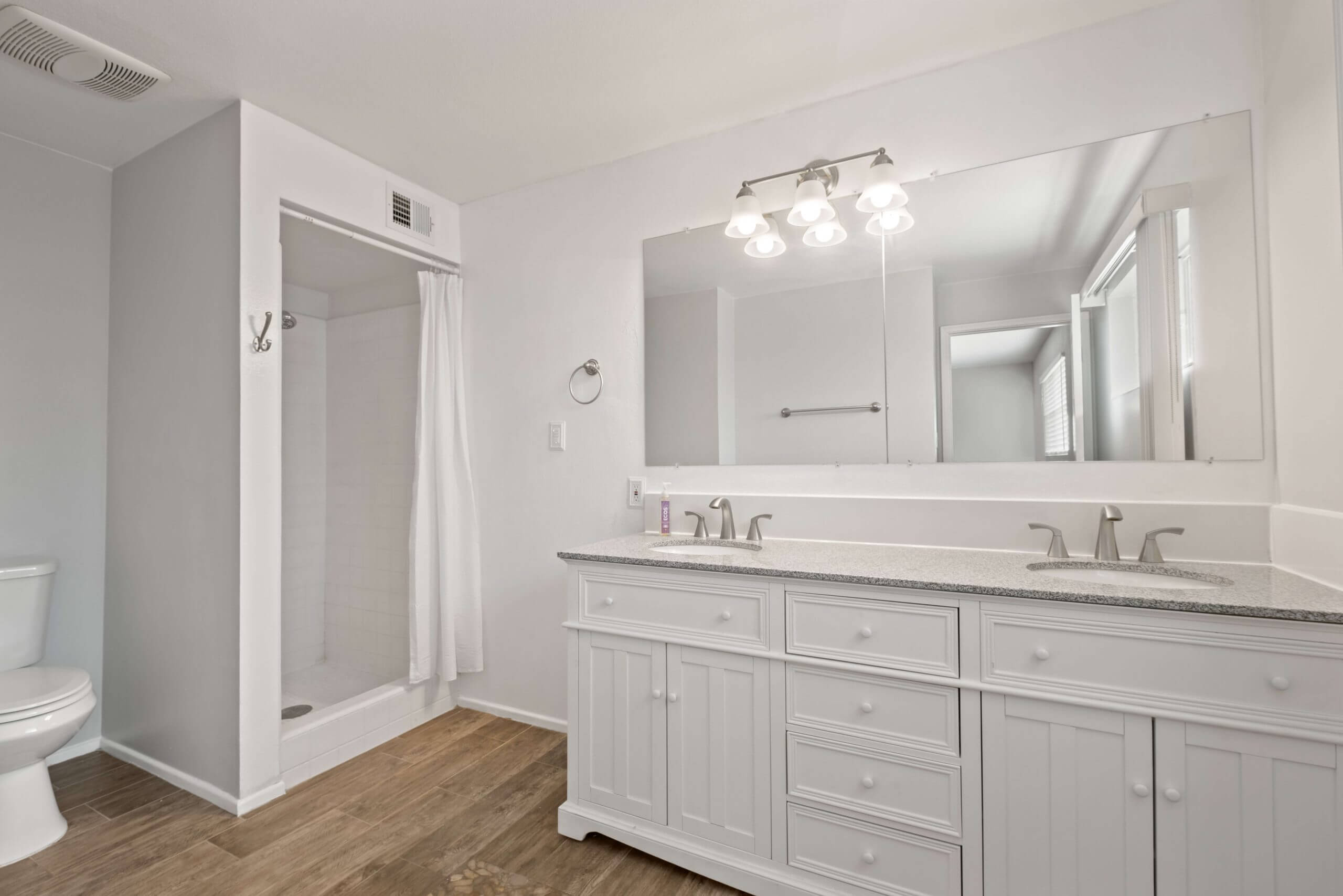 Before removing photographer's reflection in real estate photo editing